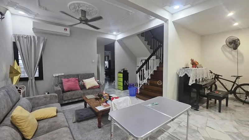 Living features: grey fabric sofa, pink accent pillows, wooden coffee table, marble flooring, ceiling fan, wall-mounted split AC, decorative ceiling rose, recessed lighting, bicycle, piano, white table with folding legs, curtains, staircase with wooden railing; style: modern. Room features: white walls, wooden staircase, decorative tablecloth.