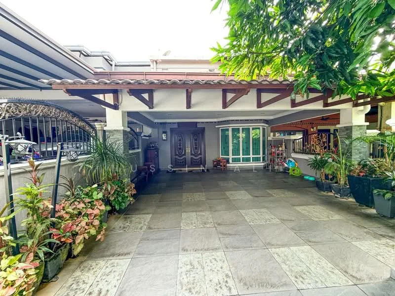 Exterior type: detached bungalow; features: paved driveway, covered car porch with tiled roof, double main entrance doors, large windows, manicured landscaping with potted plants, decorative wrought iron gate, exposed beams on porch ceiling, stone cladding on walls, tropical landscaping with greenery; style: modern.