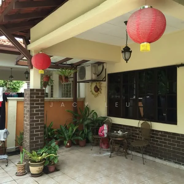 Exterior type: semi-detached house; features: red paper lanterns, brick column, cream painted walls, brown wooden beams, floor tiles, potted plants, outdoor seating with chairs and table, window with black frame, wall-mounted air conditioning unit; style: traditional.
