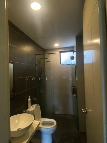 Bathroom features: grey tiled walls, white ceramic sink, chrome basin mixer faucet, walk-in shower with glass enclosure, handheld shower, one-piece toilet, framed mirror, tile flooring, window for natural light, shower caddy, toilet paper holder; style: modern.