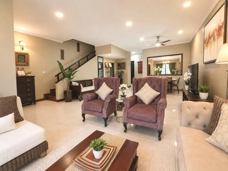 Living features: cream painted walls, white ceiling, 5-blade ceiling fan with light, 2-seater fabric sofa in white, 2 armchairs in purple upholstery, coffee table with wooden top, area rug with geometric pattern, decorative plants in ceramic pots, wall-mounted TV, framed artwork on walls, wooden staircase in background, dining area visible in background; style: contemporary.
