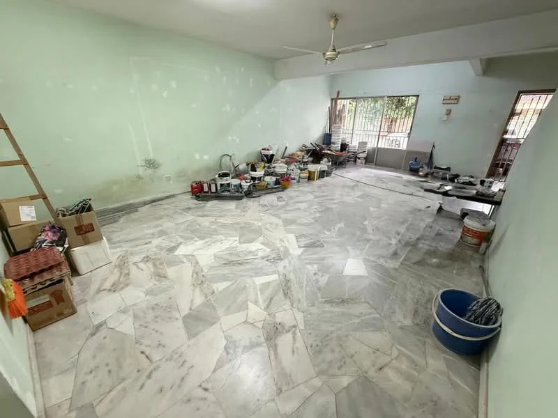 Room features: marble flooring, green painted walls, ceiling fan, multiple windows, various paint cans, cleaning supplies, storage boxes, unfinished decor.