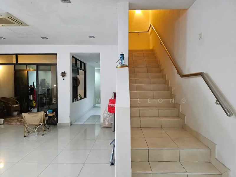 Room features: white painted walls, tile flooring, staircase with handrail, open space layout, large windows, natural light, seating area with folding chair, neutral color scheme; style: modern.
