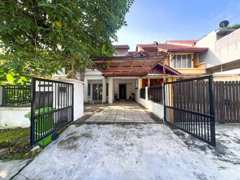 Exterior type: semi-detached house; features: black metal gate, paved driveway, green garbage bin, manicured lawn, covered car porch, exposed concrete facade, red tiled roof, two-storey structure, surrounded by greenery, front porch area; style: modern.