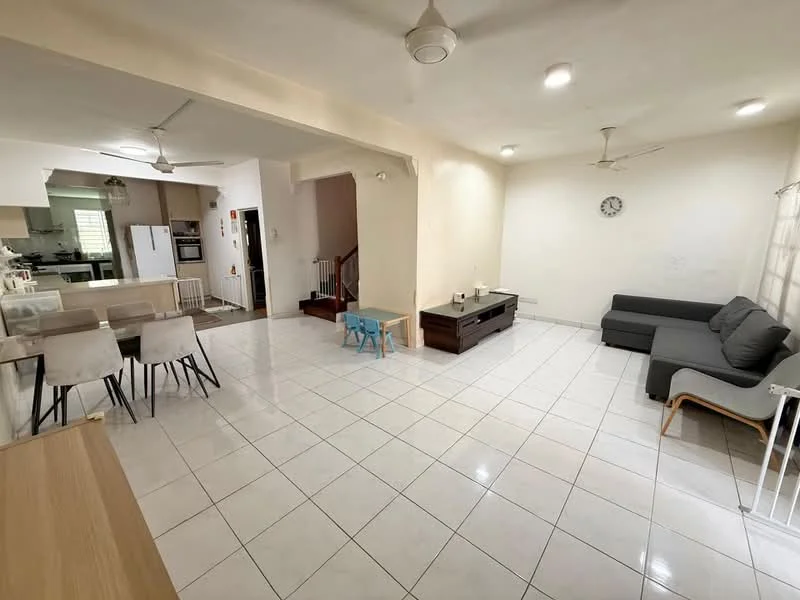 Living features: white painted walls, white tiled flooring, 5-blade ceiling fan with light, sofa in grey fabric, wooden coffee table, wall clock, area rug, natural light from windows, open layout to dining area; style: modern. Dining features: 6-seater dining table, white chairs, open layout to living area, natural light from windows; style: modern. Kitchen features: white cabinetry, stainless-steel fridge, built-in oven, open layout to dining area, natural light from windows; style: modern.