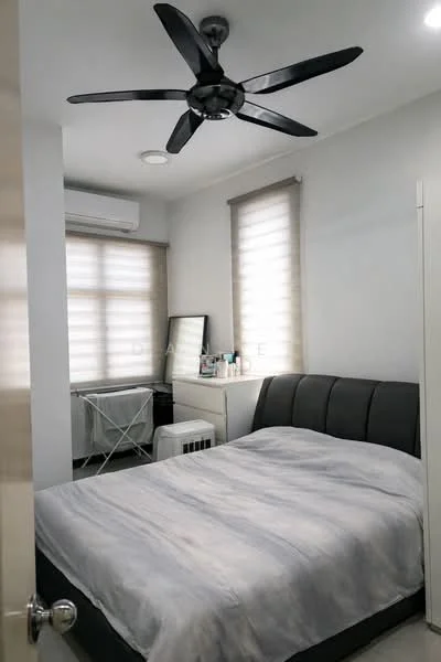 Bedroom features: king-size bed with grey upholstered headboard, 5-blade ceiling fan with light, wall-mounted split AC, white painted walls, light grey curtains, dressing table with mirror, white shelving unit, floor-to-ceiling window, wooden flooring; style: modern.
