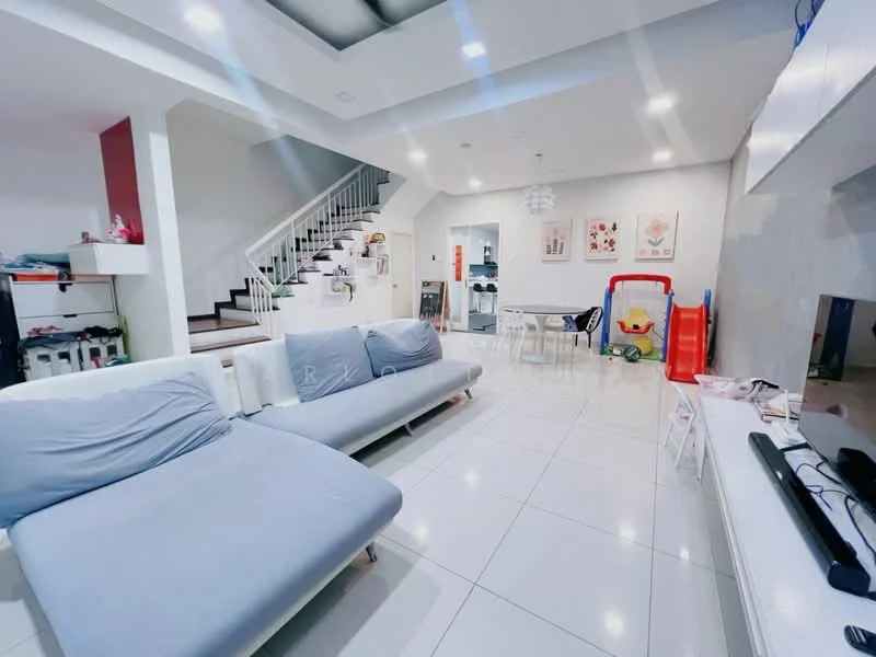 Living features: L-shape sectional sofa in light grey, white tiled flooring, recessed ceiling lights, white walls, large windows, TV console, wall-mounted TV, decorative artwork on walls, dining table with chairs, children's play area with toys, staircase leading to upper floor, open-plan layout; style: modern.