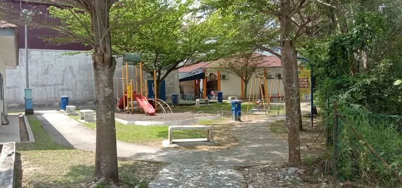 Exterior type: landscape garden; features: children's playground with slides, swing set, manicured lawn, paved walkway, mature trees providing shade, benches, fenced area, playground equipment, open space for activities; style: modern.