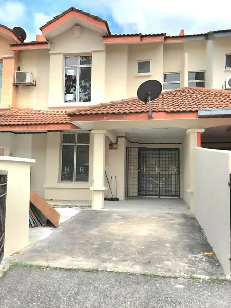 Exterior type: linked terrace house; features: cream painted facade, red tiled roof, front porch with concrete flooring, metal gate at entrance, two windows on upper floor, air conditioning unit visible, satellite dish on roof, manicured lawn, driveway with interlocking pavers; style: modern.