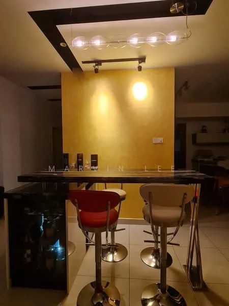 Room features: bar counter with high stools, black countertop, stainless-steel bar stools, yellow accent wall, recessed ceiling lights, pendant lighting, white tiled flooring, glass display cabinet; style: modern.