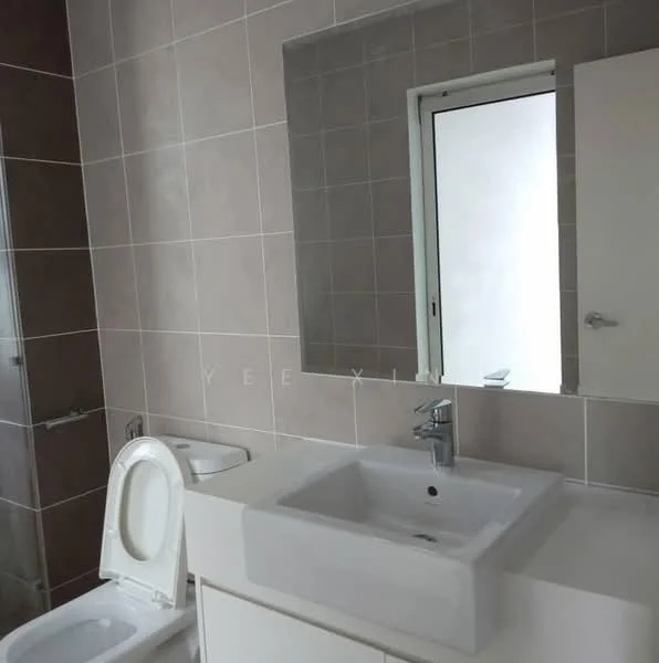 Bathroom features: white ceramic sink, chrome basin mixer faucet, white cabinetry under sink, large framed mirror, grey tiled walls, light grey tiled flooring, one-piece toilet, glass shower enclosure, window for natural light; style: modern.