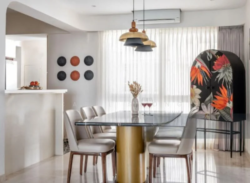 Dining features: glass dining table with gold base, upholstered dining chairs in beige, pendant lights with black, gold, and copper finishes, floor-to-ceiling windows with sheer curtains, decorative cabinet with floral design, wall-mounted art with circular shapes, marble flooring, neutral painted walls, air conditioning unit on ceiling; style: modern.