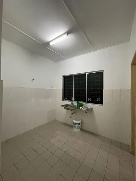 Laundry features: white painted walls, tile flooring, single-bowl stainless-steel sink, wall-mounted faucet, window with black grille, fluorescent ceiling light, cleaning supplies on sink, paint bucket on floor.
