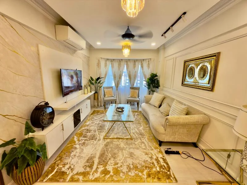 Living features: cream fabric sofa, gold accent coffee table, area rug with geometric pattern, wall-mounted TV, white entertainment unit, 5-blade ceiling fan with light, recessed downlights, floor-to-ceiling windows with sheer curtains, decorative wall paneling, indoor plants in ceramic pots, framed mirror, two accent chairs; style: modern.
