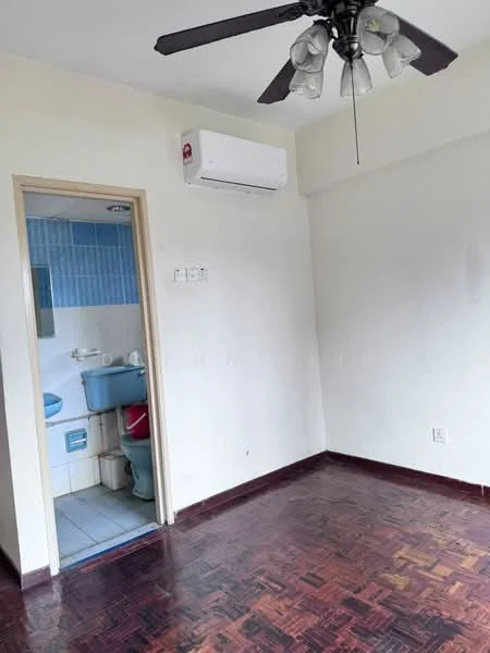 Room features: wooden flooring, white painted walls, 5-blade ceiling fan with light, wall-mounted split AC, doorway leading to bathroom, no visible furniture.