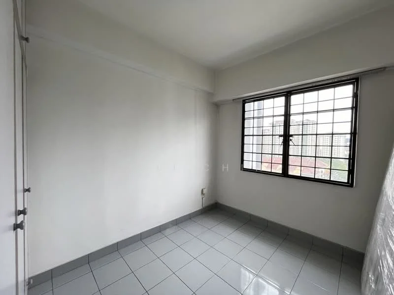Room features: white painted walls, grey tiled flooring, square window with metal grille, city view from window, no visible furniture, corner room, light from window, neutral decor; view: city.