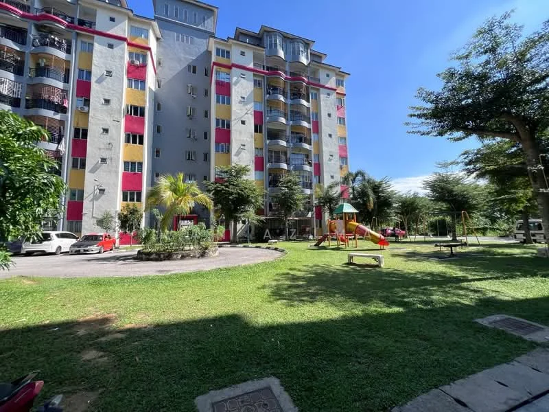 Exterior type: mid-rise condominium; features: colorful facade with red and yellow accents, balconies on each unit, landscaped garden area, playground with slides and swings, manicured lawn, surrounding trees, parking area with visible cars, multiple storeys, well-maintained exterior; style: modern.