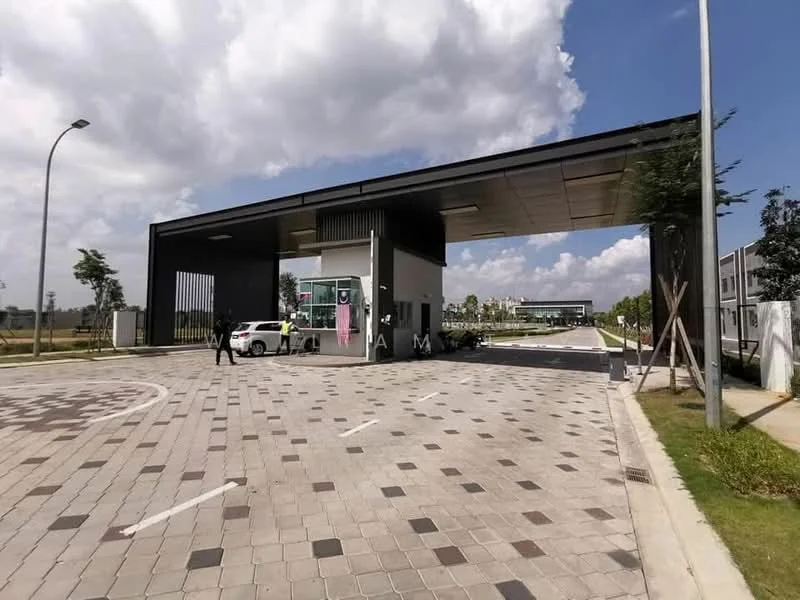 Exterior type: main entrance gate; features: modern guard house, paved driveway, landscaped greenery, security intercom panel, CCTV cameras visible, gated entry, overhead canopy, parking area for vehicles; style: modern.