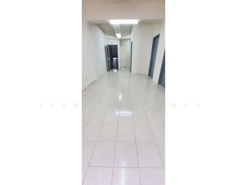 Room features: white painted walls, glossy ceramic tile flooring, fluorescent ceiling lights, metal security grille door, neutral color scheme; style: modern.