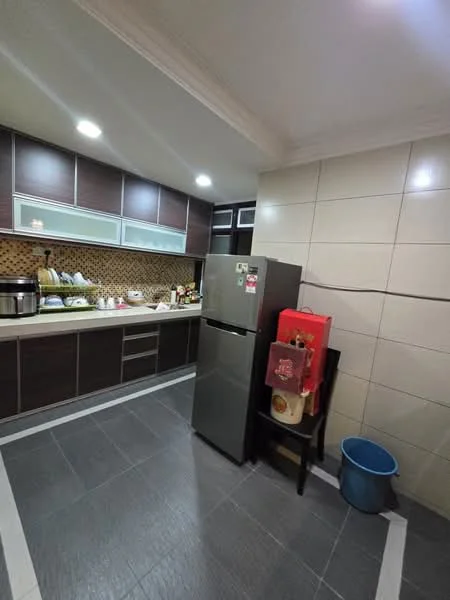 Kitchen features: dark wood cabinetry, white countertop, stainless-steel fridge, built-in oven, ceramic tile backsplash with mosaic pattern, grey tile flooring, recessed LED downlights, kitchen sink, kitchen utensils on countertop, small appliance on countertop, black dining chair, blue trash bin; style: modern.