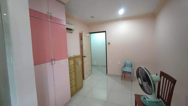 Room features: pink cabinetry, wooden cabinet, white tiled flooring, cream painted walls, wall-mounted air conditioning unit, door leading to another room, plastic chair, wooden dining chair, table fan; style: modern.