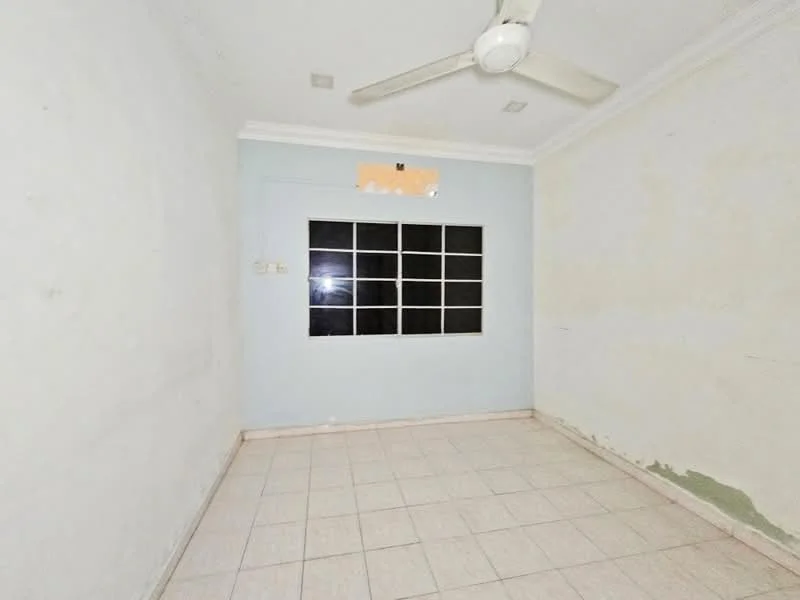 Room features: white painted walls, light blue accent wall, tile flooring, ceiling fan, large window with multiple panes, corner with peeling paint, crown moulding.