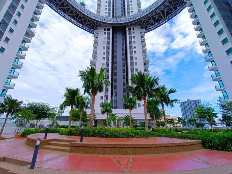 Exterior type: high-rise condominium; features: modern architectural design, large glass windows, recessed balconies, palm trees, manicured landscaping, red paved walkway, outdoor seating area, surrounding greenery, skyline view in background; style: modern.