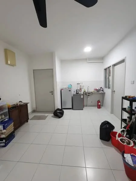 Room features: white painted walls, tile flooring, 1 wall-mounted split AC, ceiling fan, kitchenette with sink, stainless-steel fridge, freestanding fridge, kitchen counter, fire extinguisher, storage cabinet, black trash bag, red storage bin, wooden cabinet, window with view to outside; style: modern.