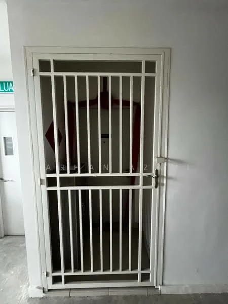 Room features: metal security gate, white painted walls, grey tiled flooring, door with red accent, light switch, door frame, visible corridor, intercom panel.
