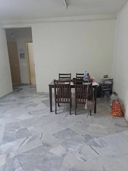 Dining features: marble flooring, white painted walls, wooden dining table, 4 wooden dining chairs, stack of magazines, plastic water bottle, shopping bag, doorway leading to another room.