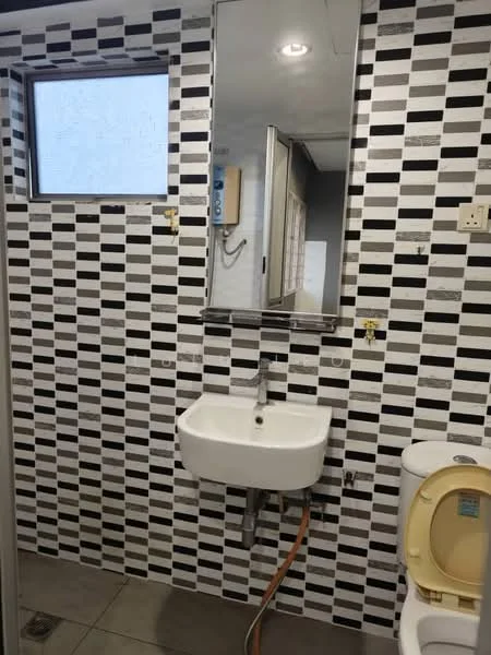 Bathroom features: black and white patterned wall tiles, grey floor tiles, single-bowl wall-mounted sink, chrome faucet, framed mirror, one-piece toilet, window for natural light, wall-mounted intercom, shower area with glass partition; style: modern.