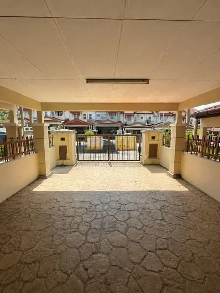 Exterior type: linked terrace house; features: covered porch area, stone-paved flooring, metal gate, fenced perimeter, surrounding residential buildings, outdoor lighting, columns supporting the roof, open space, clear sky view; style: modern.