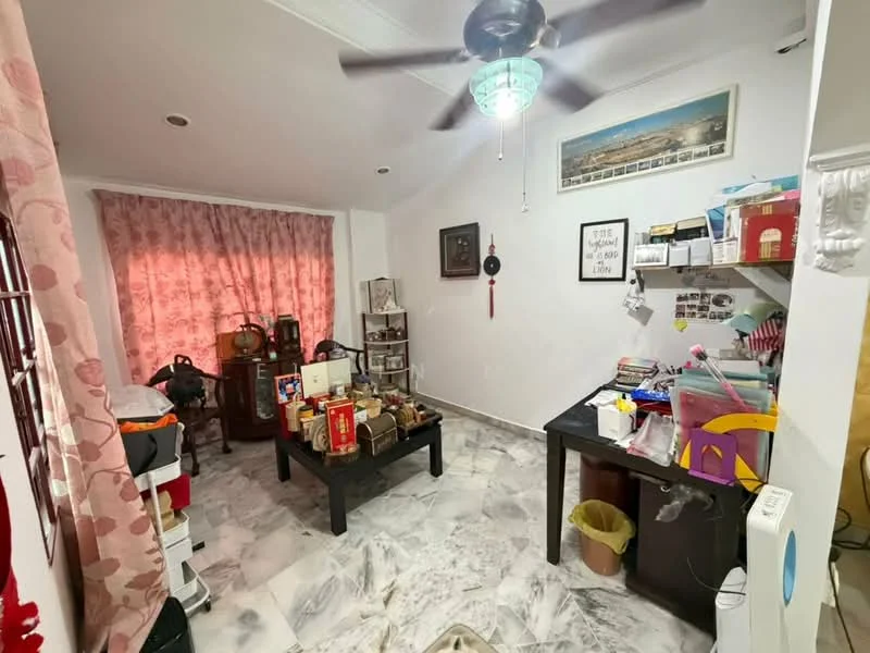 Room features: marble flooring, white painted walls, ceiling fan with light, curtains in pink, wooden furniture, decorative wall art, various decorative items, table with assorted objects, shelves with items, waste bin.