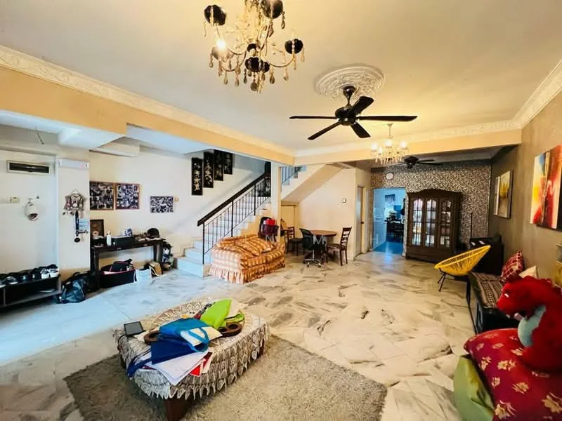 Living features: marble tile flooring, cream painted walls, tray ceiling with chandelier, 5-blade ceiling fan, large windows, wooden coffee table, sofa with colorful cushions, decorative wall art, built-in wooden cabinet, area rug with geometric pattern, dining table with chairs, staircase leading to upper floor; style: contemporary.