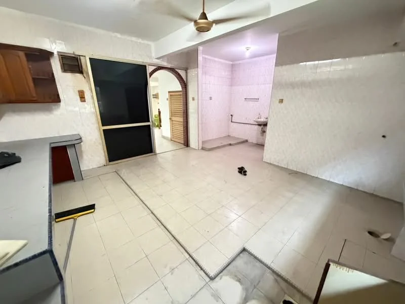 Room features: white tiled flooring, light pink tiled walls, wooden cabinetry, ceiling fan, single-basin sink, wall-mounted faucet, open layout, doorway leading to another room, window with no visible treatment, plumbing fixtures visible, empty space with no furniture, light fixture on ceiling.