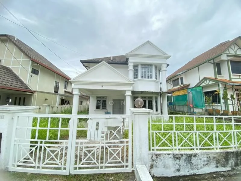 Exterior type: detached bungalow; features: white painted facade, pillars at entrance, gated front yard, manicured lawn, two-storey structure, sloping tiled roof, front porch, surrounded by greenery, driveway, fenced perimeter; style: modern.
