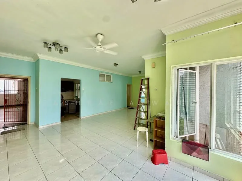 Living features: white tiled flooring, light green painted walls, cream painted walls, ceiling fan, recessed downlights, large windows with sheer curtains, open layout to kitchen, wooden ladder, small wooden cabinet, red plastic stool; style: modern. Kitchen features: white tiled flooring, dark cabinetry, open layout to living area; style: modern.