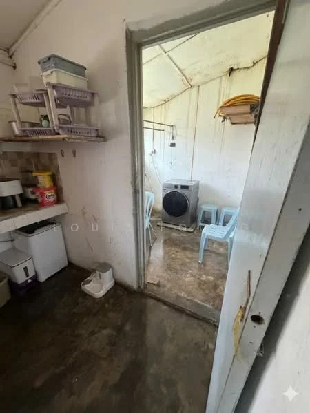 Laundry features: washing machine, plastic chairs, concrete flooring, white walls, shelving units, sink, doorway leading to another room.
