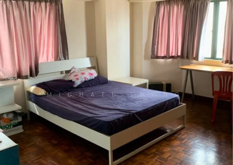 Bedroom features: queen-size bed with dark bedding, white bed frame, two bedside tables, wooden flooring, pink curtains, green window with view, study desk with chair, decorative pillows.