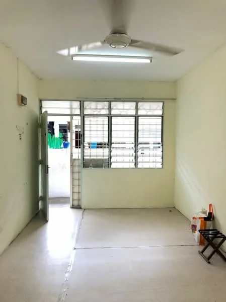 Room features: white painted walls, concrete flooring, ceiling fan, window with metal grilles, door leading outside, natural light from window, light fixture on ceiling.