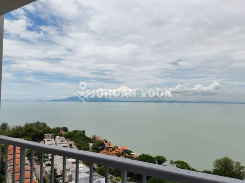 Exterior type: high-rise condominium; features: sea view, balcony railing, surrounding greenery, urban landscape, cloudy sky, waterfront, distant mountains; style: modern.