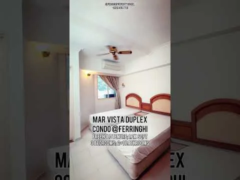 Bedroom features: white painted walls, wooden flooring, 5-blade ceiling fan, large window with sheer curtains, upholstered headboard, built-in wardrobe, bedside lamps, empty mattress frame.