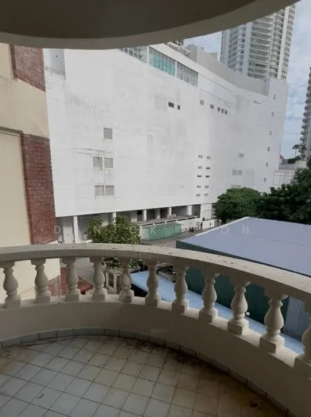 Room features: balcony with balustrade, tiled flooring, view of adjacent building, view of parking area, exterior wall with white paint, surrounding greenery; view: city.