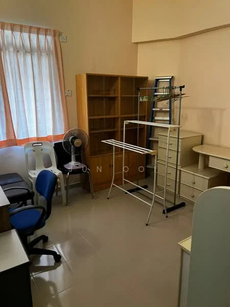 Room features: white painted walls, light-colored flooring, large window with sheer curtains, wooden bookshelf, metal drying rack, desk with drawers, two office chairs, standing fan.