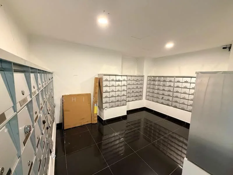 Room features: mailbox units, black polished tile flooring, white painted walls, recessed ceiling lights, cardboard box, security camera, corner wall, open space; style: modern.