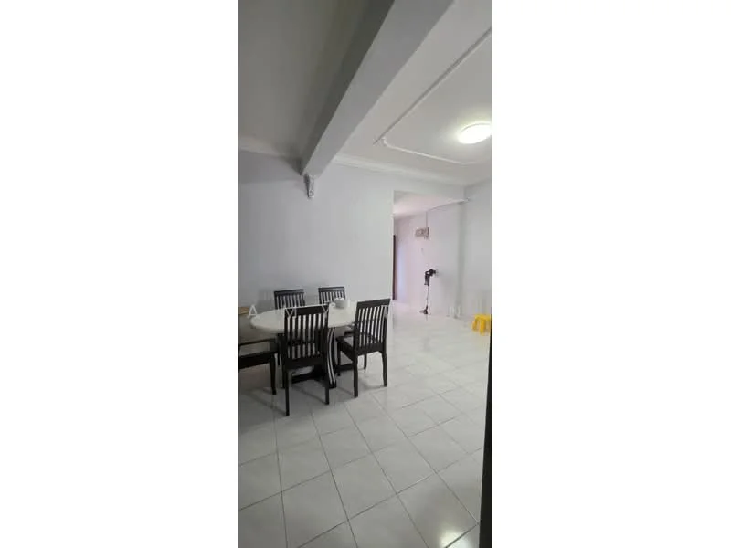 Dining features: white painted walls, glossy white tile flooring, dining table with chairs, ceiling light fixture, open layout, neutral color scheme, corner of living area visible, doorway leading to another room; style: modern.