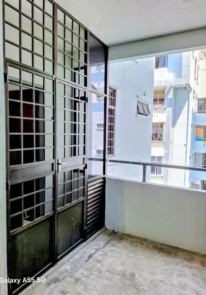 Room features: sliding glass door, metal grille door, concrete flooring, white painted walls, balcony railing, window with grid pattern, natural light from outside; style: modern.