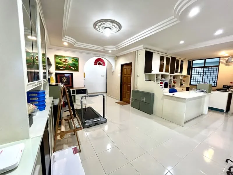 Room features: white painted walls, glossy white tile flooring, tray ceiling with decorative moulding, recessed downlights, large windows with grid pattern, wooden door with decorative panel, built-in cabinetry with glass doors, treadmill, open layout, wall-mounted shelving, decorative artwork on walls, ceiling fan; style: modern.