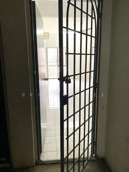Room features: metal security gate, white walls, tile flooring, natural light from windows, open space, doorway leading to another room.