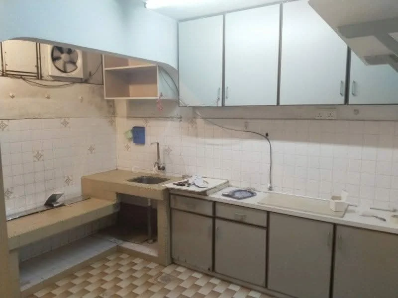 Kitchen features: single-bowl stainless-steel sink, chrome pull-down faucet, laminate countertop, white cabinetry with flat-panel doors, built-in shelving, wall-mounted exhaust fan, white tiled backsplash, checkered tile flooring, under-sink storage, open space for appliances.